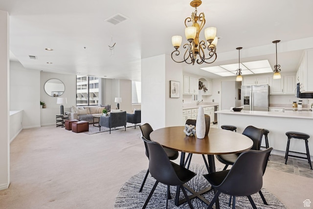 48 W 300 S Unit 1405N, Salt Lake City, UT 84101 - dining area with light colored carpet and a chandelier