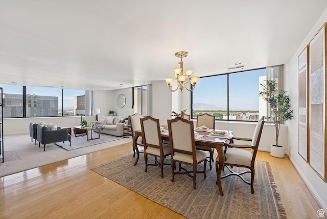 48 W 300 S Unit 1405N, Salt Lake City, UT 84101 - dining space featuring wood finished floors and a chandelier