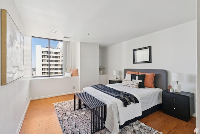 48 W 300 S Unit 1405N, Salt Lake City, UT 84101 - bedroom with hardwood / wood-style flooring and recessed lighting