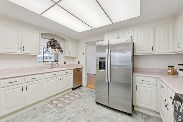 48 W 300 S Unit 1405N, Salt Lake City, UT 84101 - kitchen with stainless steel appliances, white cabinetry, and light countertops