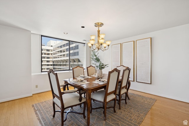 48 W 300 S Unit 1405N, Salt Lake City, UT 84101 - dining area with a chandelier and wood finished floors