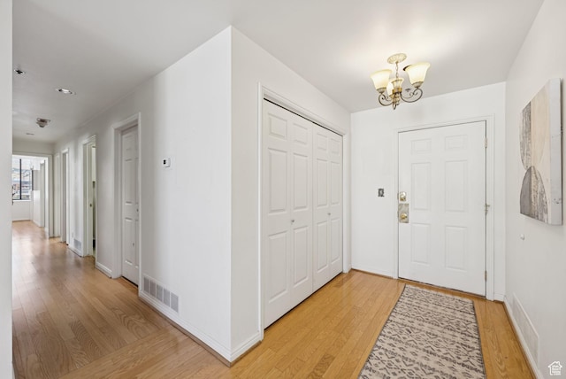 48 W 300 S Unit 1405N, Salt Lake City, UT 84101 - foyer entrance with a chandelier and light wood-style floors