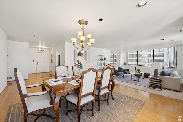 48 W 300 S Unit 1405N, Salt Lake City, UT 84101 - dining space featuring a chandelier and light wood finished floors