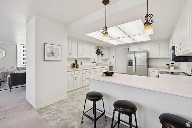 48 W 300 S Unit 1405N, Salt Lake City, UT 84101 - kitchen featuring stainless steel fridge, a peninsula, light countertops, and white cabinetry