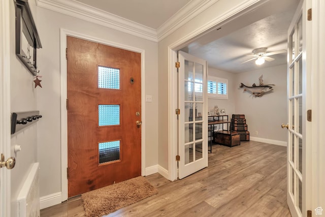 3161 S 8520 W, Magna, UT 84044 - foyer entrance featuring french doors, light wood-type flooring, crown molding, and a ceiling fan