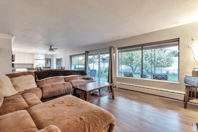 3161 S 8520 W, Magna, UT 84044 - living room with baseboard heating, a ceiling fan, hardwood / wood-style flooring, and recessed lighting