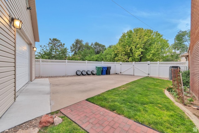 3161 S 8520 W, Magna, UT 84044 - fenced backyard with a gate and a patio area