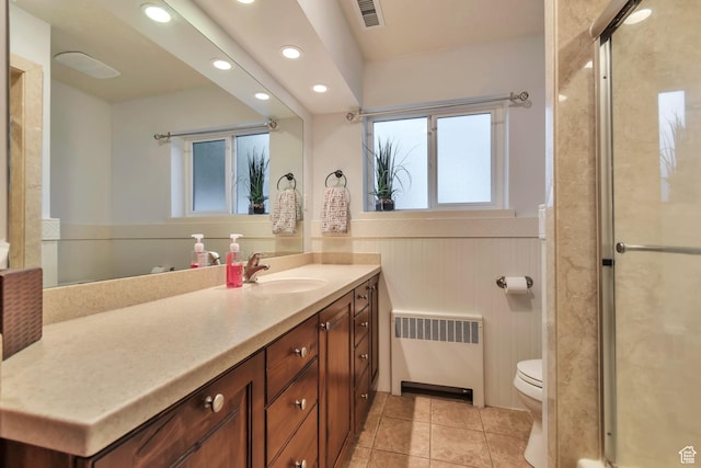 3161 S 8520 W, Magna, UT 84044 - bathroom featuring radiator, recessed lighting, vanity, wainscoting, and tile patterned floors