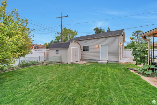 3161 S 8520 W, Magna, UT 84044 - rear view of property featuring a fenced backyard and an outdoor structure