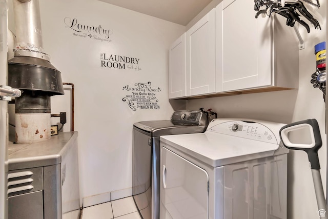 3161 S 8520 W, Magna, UT 84044 - washroom featuring cabinet space, independent washer and dryer, and light tile patterned floors