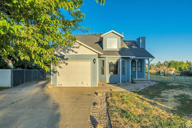 2115 W 1225 N, Layton, UT 84041 - view of front of home featuring driveway, an attached garage, and a chimney