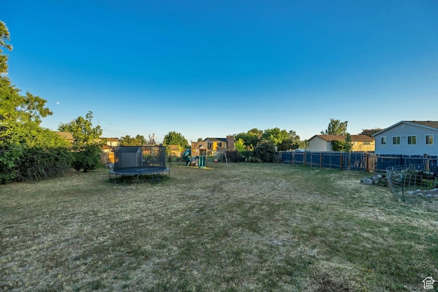2115 W 1225 N, Layton, UT 84041 - fenced backyard with a trampoline and a playground