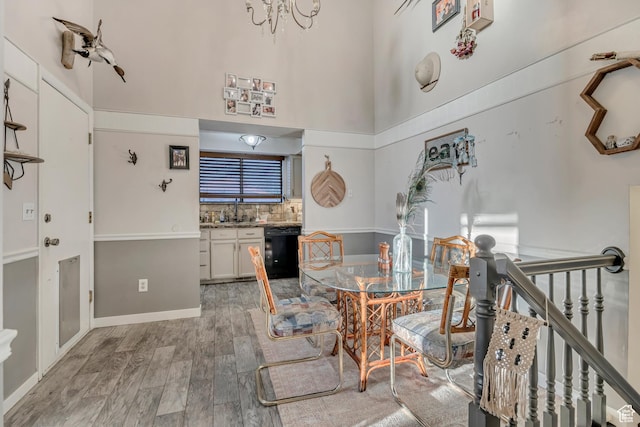 2115 W 1225 N, Layton, UT 84041 - dining space featuring a high ceiling, light wood-style floors, and a chandelier