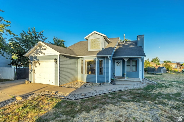 2115 W 1225 N, Layton, UT 84041 - view of front facade with an attached garage, a chimney, a shed, concrete driveway, and roof with shingles