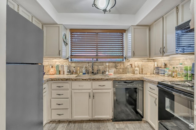 2115 W 1225 N, Layton, UT 84041 - kitchen featuring black appliances, tasteful backsplash, light wood-style floors, white cabinetry, and light stone countertops