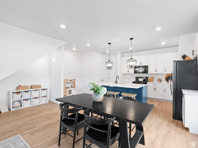 132 E Geyser Ct, Saratoga Springs, UT 84045 - dining space with light wood-style floors and recessed lighting