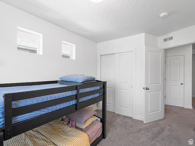 132 E Geyser Ct, Saratoga Springs, UT 84045 - bedroom with a closet, carpet floors, and a textured ceiling