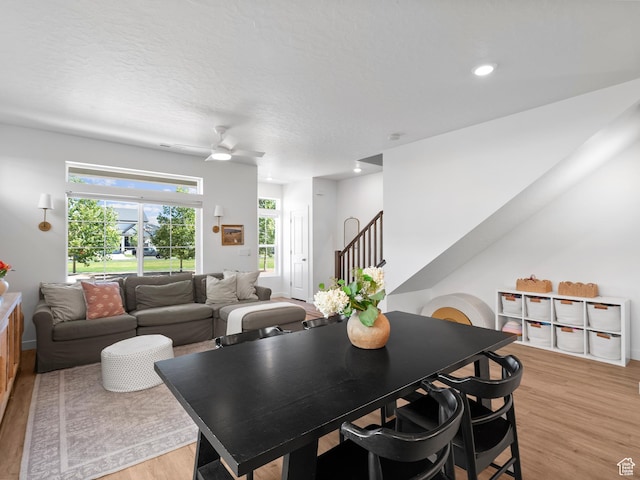 132 E Geyser Ct, Saratoga Springs, UT 84045 - dining space featuring light wood finished floors, ceiling fan, stairway, and recessed lighting