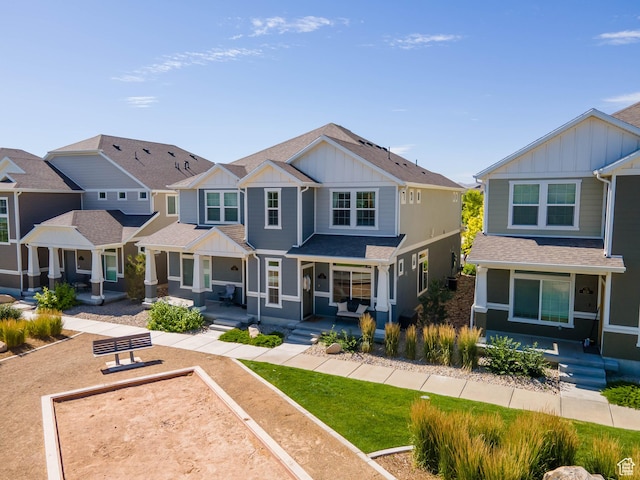 132 E Geyser Ct, Saratoga Springs, UT 84045 - craftsman-style home featuring board and batten siding, a porch, roof with shingles, and a residential view
