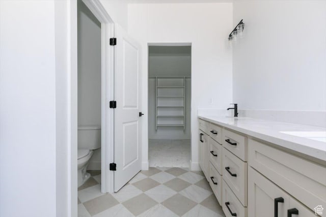 880 E 130 N, Hyde Park, UT 84318 - full bathroom featuring tile patterned floors, double vanity, and a walk in closet