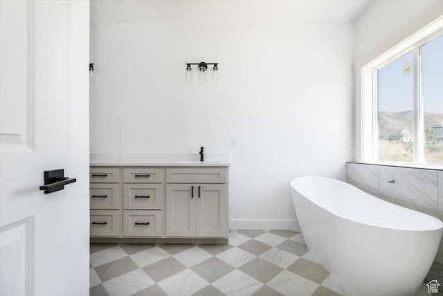 880 E 130 N, Hyde Park, UT 84318 - full bath featuring a freestanding bath, vanity, and tile patterned floors