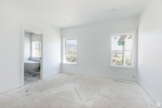 880 E 130 N, Hyde Park, UT 84318 - unfurnished bedroom with multiple windows and connected bathroom