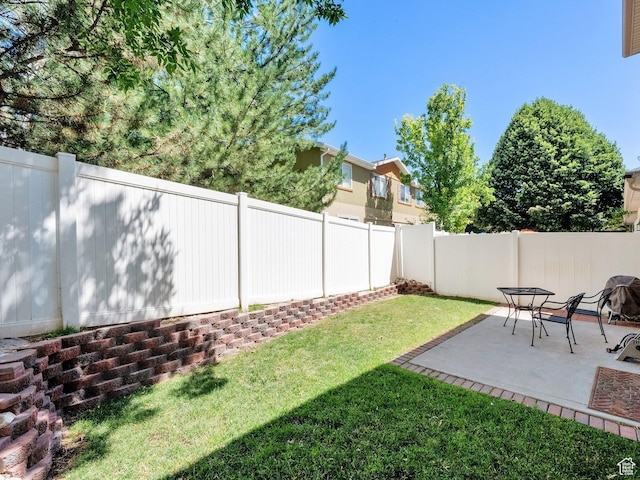 3908 W Lorient Ave, West Jordan, UT 84084 - fenced backyard with a patio area