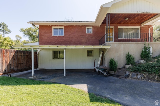 85 E 500 S, Providence, UT 84332 - back of property with brick siding, a carport, and driveway