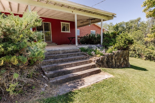 85 E 500 S, Providence, UT 84332 - doorway to property with covered porch and a lawn