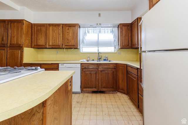 85 E 500 S, Providence, UT 84332 - kitchen with white appliances, light floors, and brown cabinets