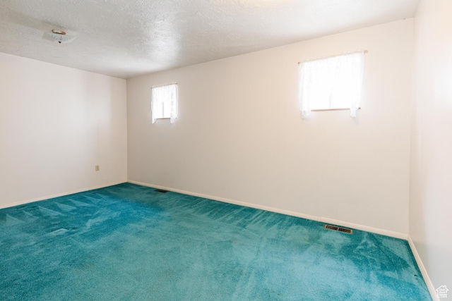 85 E 500 S, Providence, UT 84332 - unfurnished room featuring carpet flooring and a textured ceiling