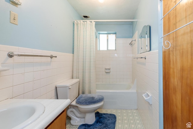 85 E 500 S, Providence, UT 84332 - full bathroom with tile walls, tile patterned flooring, vanity, shower / bath combination with curtain, and a wainscoted wall
