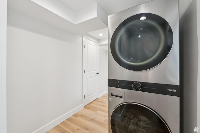 932 W Walden Meadows Dr S, Salt Lake City, UT 84123 - laundry room featuring stacked washer and clothes dryer, light wood-type flooring, and recessed lighting