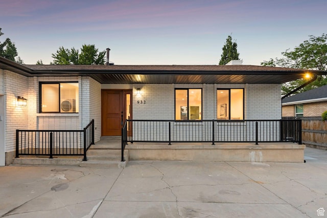 932 W Walden Meadows Dr S, Salt Lake City, UT 84123 - view of front of property with a porch and brick siding