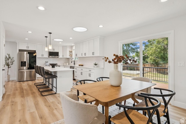 932 W Walden Meadows Dr S, Salt Lake City, UT 84123 - dining area featuring light wood finished floors and recessed lighting