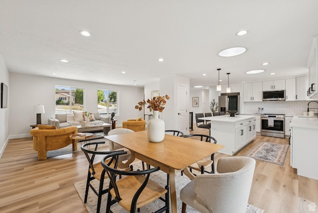 932 W Walden Meadows Dr S, Salt Lake City, UT 84123 - dining space with recessed lighting and light wood-style flooring