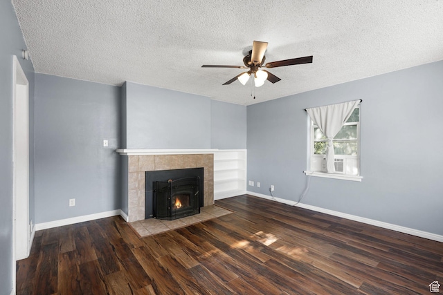 437 E 100 N, Brigham City, UT 84302 - unfurnished living room featuring ceiling fan, wood finished floors, a fireplace, a textured ceiling, and cooling unit