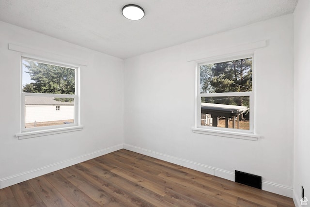 437 E 100 N, Brigham City, UT 84302 - unfurnished room featuring dark wood-style flooring and baseboards
