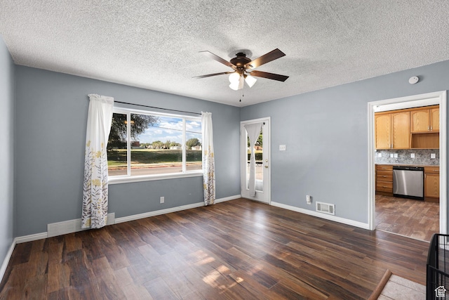 437 E 100 N, Brigham City, UT 84302 - unfurnished living room with ceiling fan, dark wood-style floors, and a textured ceiling