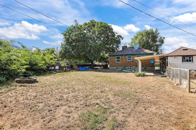 437 E 100 N, Brigham City, UT 84302 - view of yard featuring an outdoor fire pit and a patio area