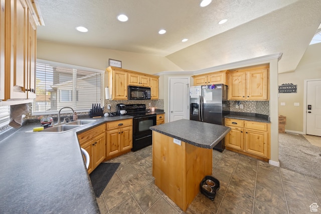 4022 S 2725 W, Roy, UT 84067 - kitchen featuring black appliances, vaulted ceiling, a kitchen island, tasteful backsplash, and dark countertops