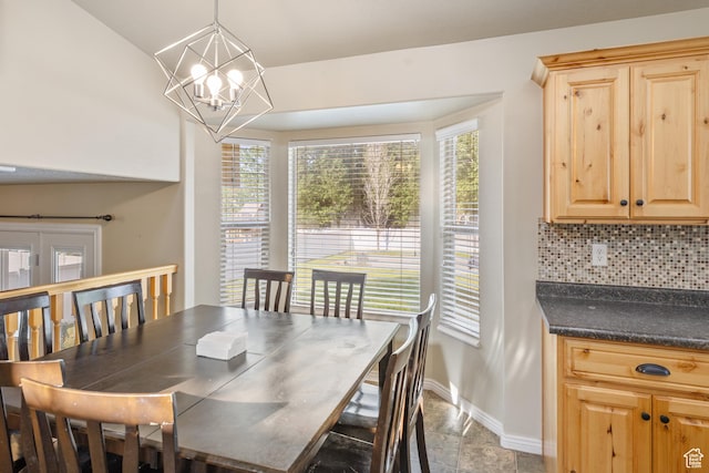 4022 S 2725 W, Roy, UT 84067 - dining area with baseboards and a chandelier