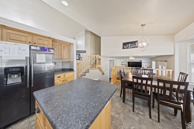 4022 S 2725 W, Roy, UT 84067 - kitchen with stainless steel fridge with ice dispenser, dark countertops, light brown cabinetry, backsplash, and a chandelier