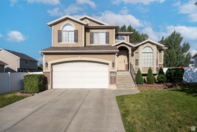 4022 S 2725 W, Roy, UT 84067 - view of front of property with concrete driveway, an attached garage, stucco siding, and brick siding