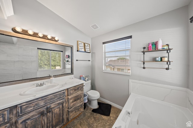 4022 S 2725 W, Roy, UT 84067 - bathroom featuring vaulted ceiling, a garden tub, and vanity