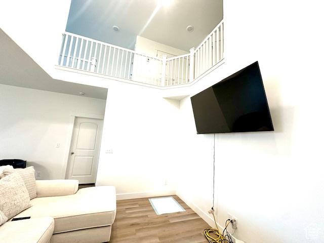4542 Parkes Peak Ln, Riverton, UT 84096 - living area with a high ceiling and light wood-style flooring