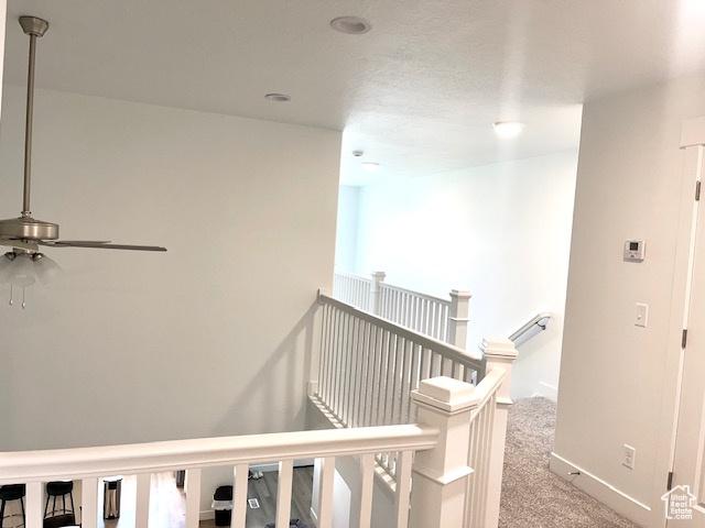 4542 Parkes Peak Ln, Riverton, UT 84096 - hall with an upstairs landing and carpet flooring