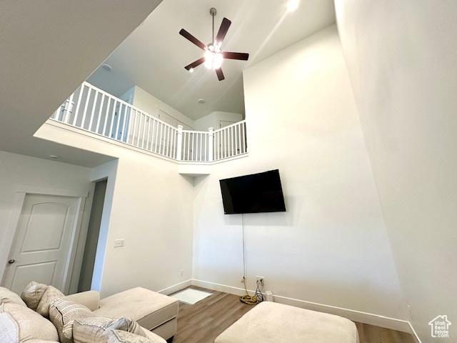 4542 Parkes Peak Ln, Riverton, UT 84096 - living area with high vaulted ceiling, wood finished floors, and a ceiling fan