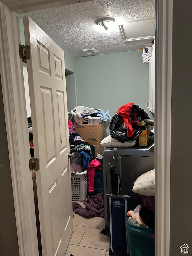83 E 1820 S, Orem, UT 84058 - washroom with washer and clothes dryer, tile patterned flooring, and a textured ceiling