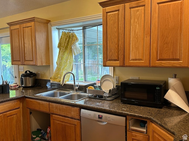 83 E 1820 S, Orem, UT 84058 - kitchen with dishwashing machine, black microwave, brown cabinets, and dark stone counters